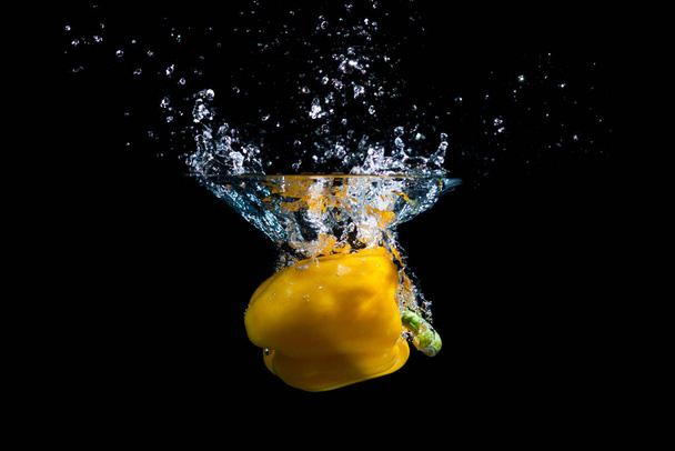 yellow pepper splash in water - Photo, Image
