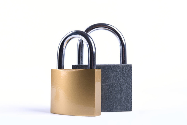 Two Locked grey and golden Padlock on the white background. - Photo, Image