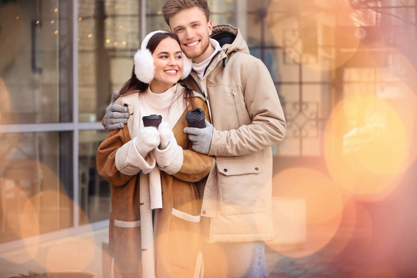 Happy young couple walking outdoors on winter day - Fotoğraf, Görsel