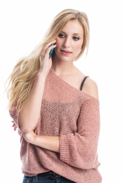 a blonde woman on the phone with a cell phone - Fotoğraf, Görsel