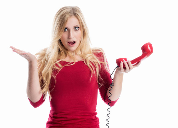 annoyed woman shouting into the telephone receiver - Zdjęcie, obraz