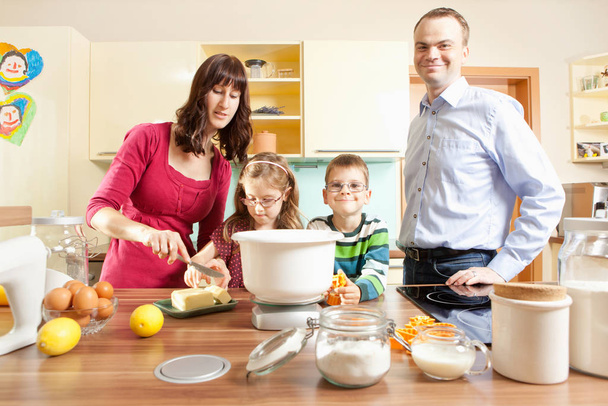 young family baking in the kitchen at - Fotoğraf, Görsel