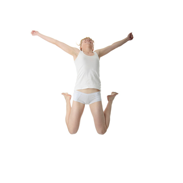 Young smiling woman jumping - Φωτογραφία, εικόνα