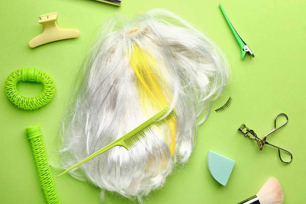 White wig and hairdresser tools on color background - Photo, Image