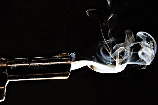 cigarette with smoke on black background - Fotó, kép