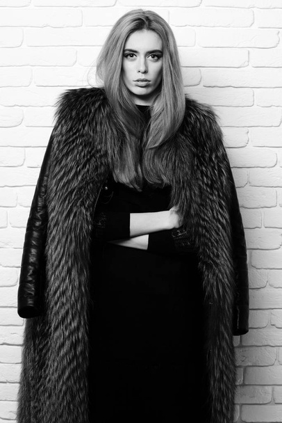 fashionable sexy woman in fur on white brick wall studio background - Fotografie, Obrázek
