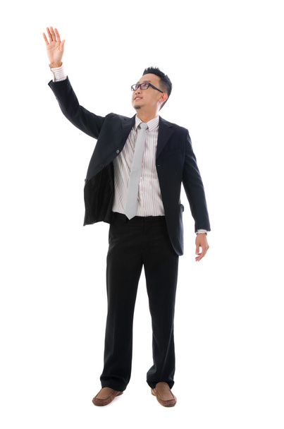 Business man touching an imaginary screen or button on white bac - Photo, Image