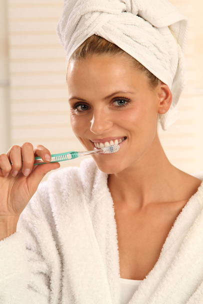 woman brushing her teeth - 写真・画像