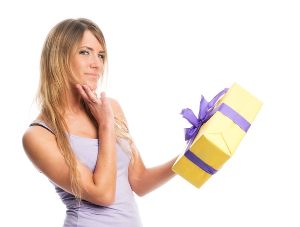 blond woman holding a yellow gift - Photo, Image