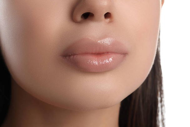 Young woman with beautiful full lips on white background, closeup - Foto, afbeelding