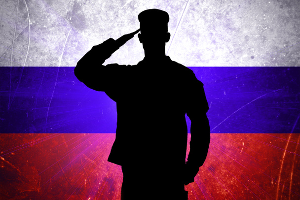 Ylpeä venäläinen sotilas Venäjän lipun taustalla
 - Valokuva, kuva