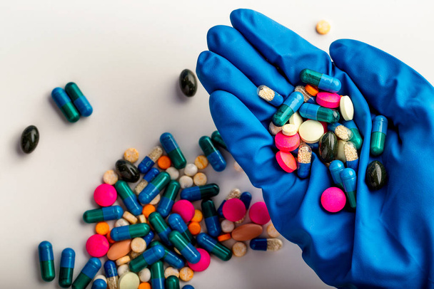 Hands full of medication. Tablets and pils - Fotografie, Obrázek