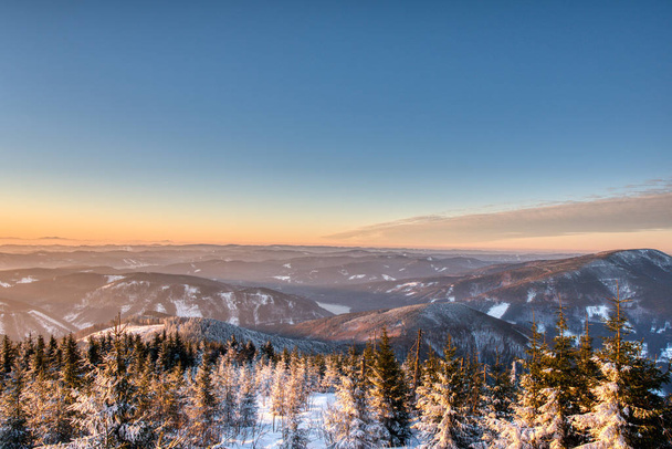 Colorful winter sunrise in mountains. beskydy czech - Fotó, kép