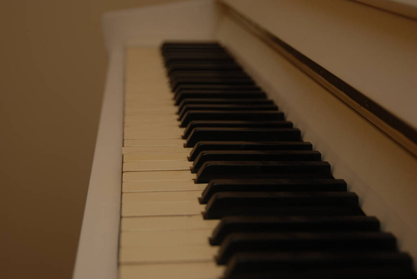 The keys of a white old vintage piano. - Photo, Image