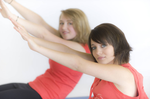 two young women doing pilates - Φωτογραφία, εικόνα