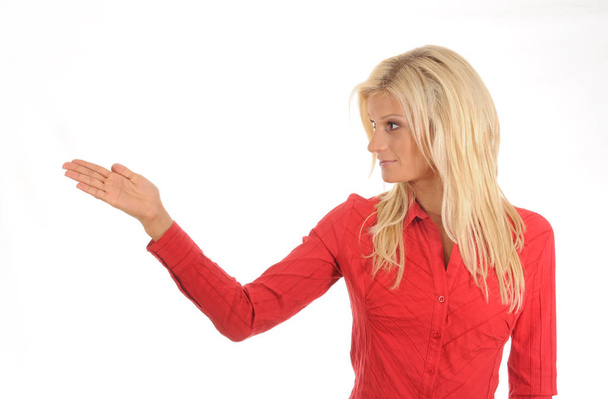 young woman gesturing,wearing a red blouse.isolated over white. - Photo, Image