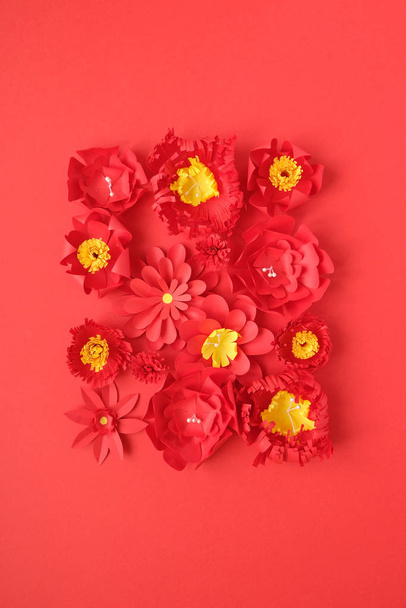Hello, spring. With red paper flowers on red - Foto, afbeelding