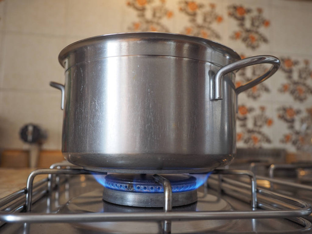 Detail of a saucepot on a gas cooker - Foto, Imagen