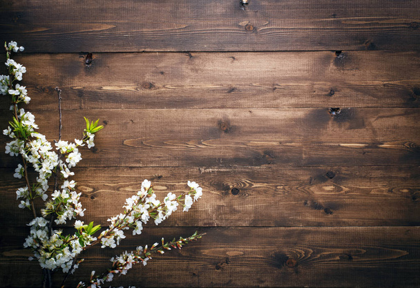 Flowers on wood texture background with copyspace - Photo, Image