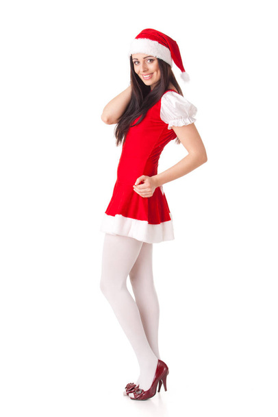 Young woman in Santa costume on a white background.  Christmas. - Fotó, kép