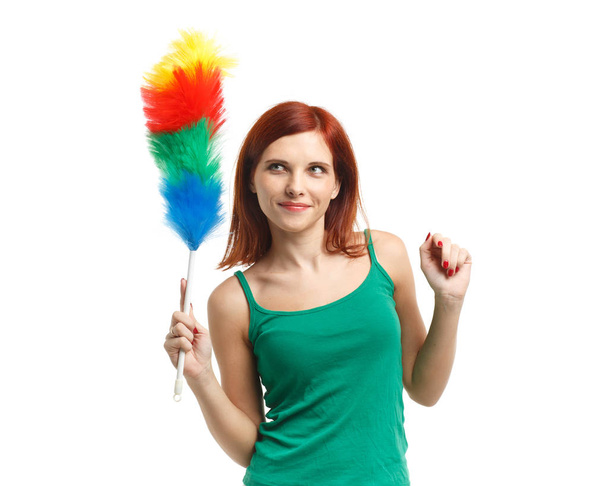 Young beautiful woman with cleaning whisk on a white background. Housekeeping. Cleaning woman. - Φωτογραφία, εικόνα