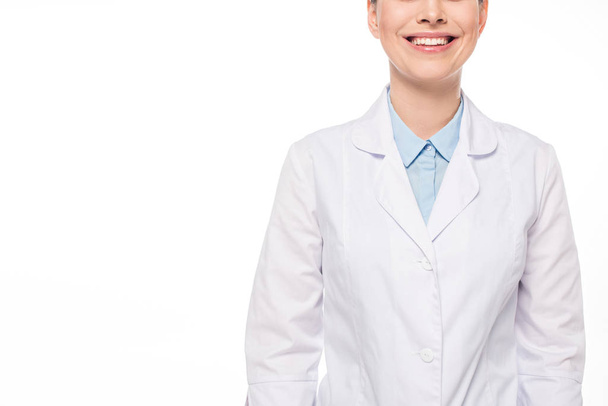 Cropped view of smiling doctor in white coat isolated on white - Фото, зображення