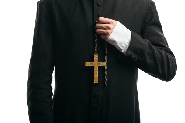cropped view of catholic priest holding golden cross isolated on white - Foto, afbeelding