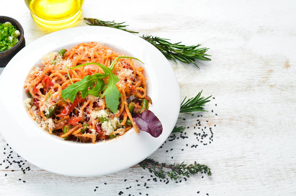 Pasta with tomatoes and vegetables. Carbonara. Italian cuisine. Top view. Free space for your text. - Fotografie, Obrázek