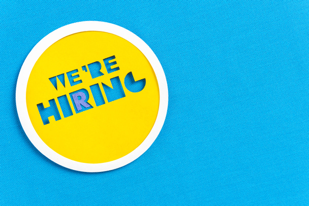 We are hiring button design on blue textured background with spa - Photo, Image
