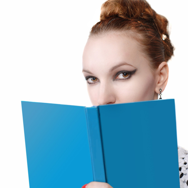 Portrait of attractive young woman with blue book - Foto, Imagem