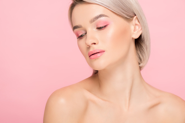 naked blonde girl with pink makeup, isolated on pink - Fotografie, Obrázek