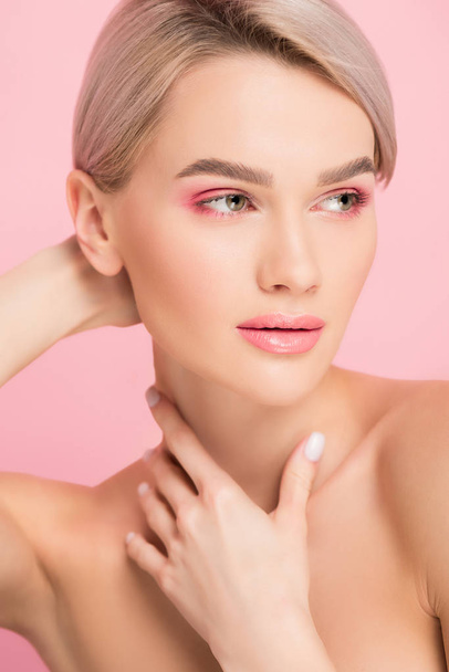 beautiful naked girl with pink makeup, isolated on pink - Foto, afbeelding