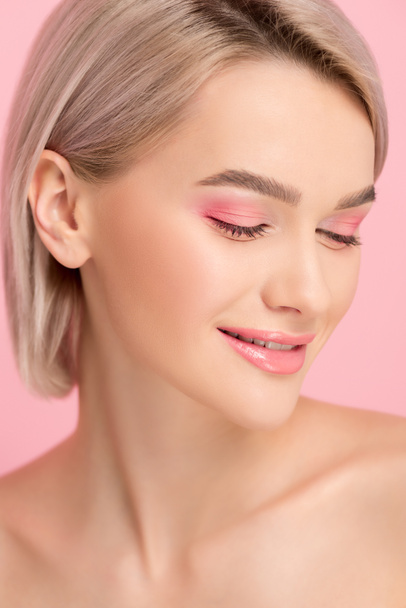 beautiful smiling girl with pink makeup, isolated on pink - Fotoğraf, Görsel