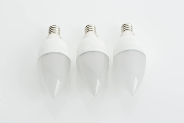led light bulbs,candles - Foto, afbeelding