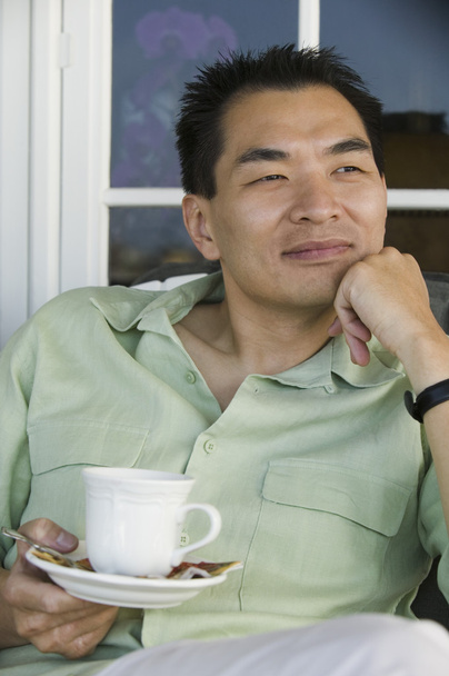 Man with coffee cup - Фото, изображение