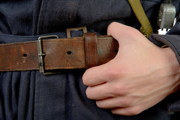 closeup on the vintage belt of a worker - 写真・画像