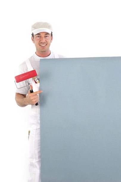 Decorator with a board left blank for your message - Foto, imagen