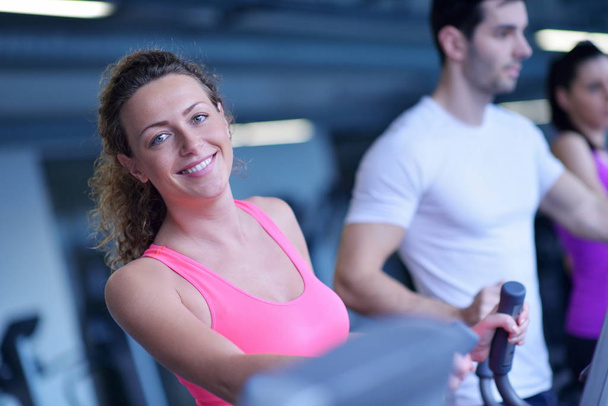 sport, fitness, lifestyle, technology and people concept - smiling woman exercising on treadmill in gym - Foto, Imagem