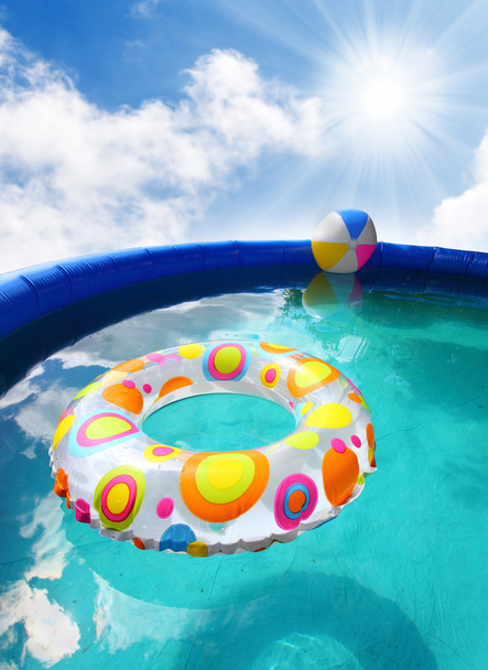 Inflatable pool with floating plastic toys. - Photo, Image