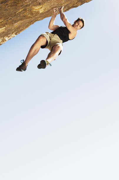 Climber Jumping off Cliff - Foto, imagen