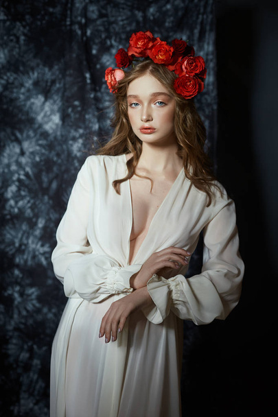 Romantic spring portrait of a young blonde woman with a wreath o - Fotó, kép