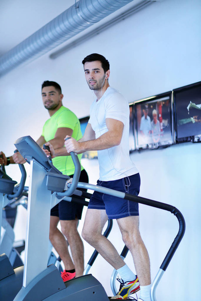 group of young people running on treadmills in modern sport  gym - Valokuva, kuva