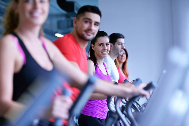group of young people running on treadmills in modern sport  gym - Fotografie, Obrázek
