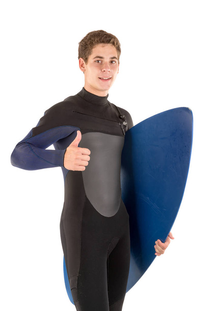 Teenager in wet suit with skimboard posing isolated in white - Foto, Imagem