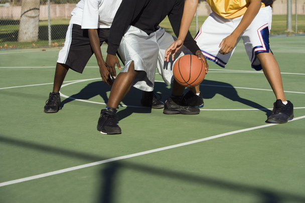 Player being tackled in basketball - Фото, зображення