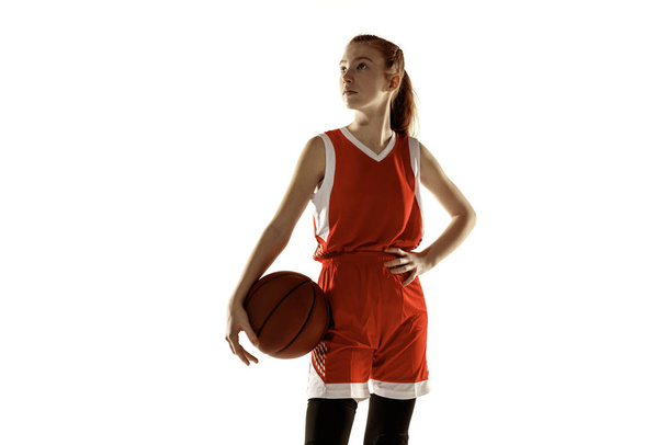 Young caucasian female basketball player against white studio background - Foto, Bild