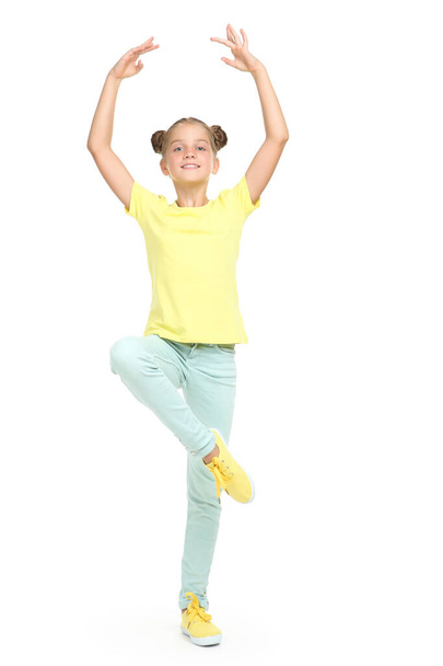 Young beautiful girl dances ballet on white background - Foto, immagini