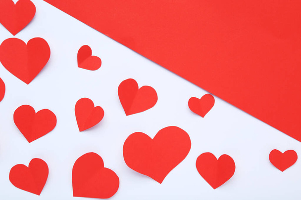 Paper hearts on white and red background - Foto, Imagem