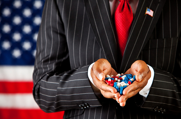 Politician: Holding a Handful of Precribed Capsules - Foto, imagen