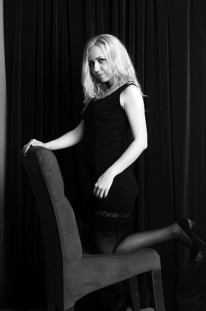 Fashion photo of young lady in elegant black dress - Foto, Imagen